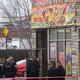 Chicago police officers investigate the scene where four people were shot and killed at a restaurant in the 2700 block of East 75th Street on March 30, 2017. (Joshua Lott/Getty Images)